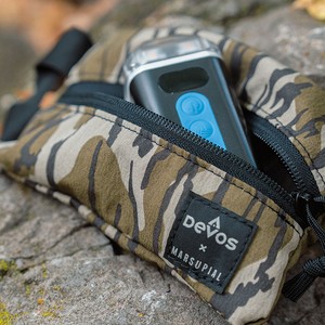 Devos LightRanger light in a Devos x Marsupial Mossy Oak Bottomland zipper pouch
