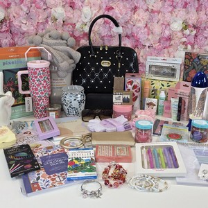 Enchanted String holiday haul with a black handbag, tumbler, makeup, jewelry and stationery