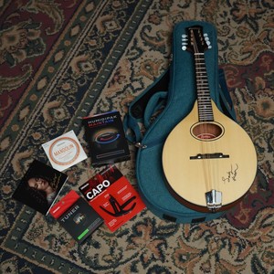 Signed Eastman mandolin in a blue case with a D'Addario capo, tuner, strings and Lady Moon CD