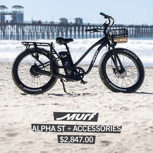 Black Murf Alpha ST electric bike with front basket on the beach by a pier