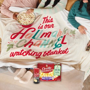 Orville Redenbacher's popcorn boxes and seasoning on a This is Our Hallmark Channel Watching Blanket