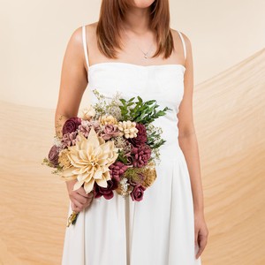 Bride holding a Sola Wood Flowers bridal bouquet